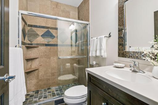 3/4 bath adjacent to the lower level bedroom and the spacious family room