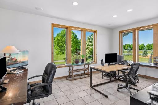 Main level bonus room - currently a home office but would make a great sunroom, playroom, library or cozy family TV room