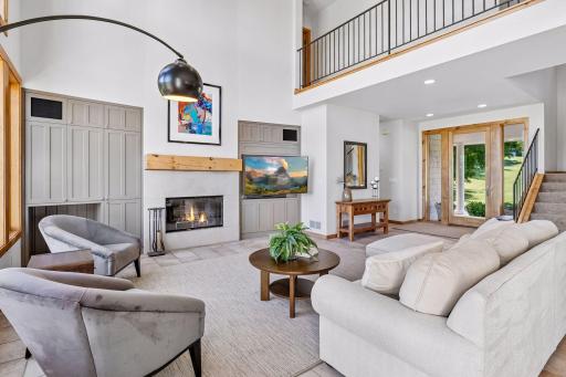 Upper level walkway separates the private, primary suite from the two secondary bedrooms and full, tiled bathroom.