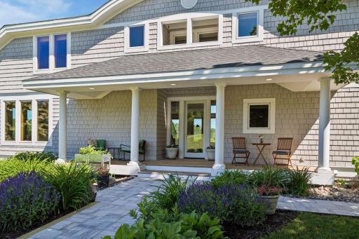 Imagine morning coffee on this fabulous covered front porch