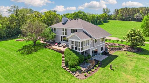 Light-filled, airy three season porch. Easy lower-level access to the finished, lower level.