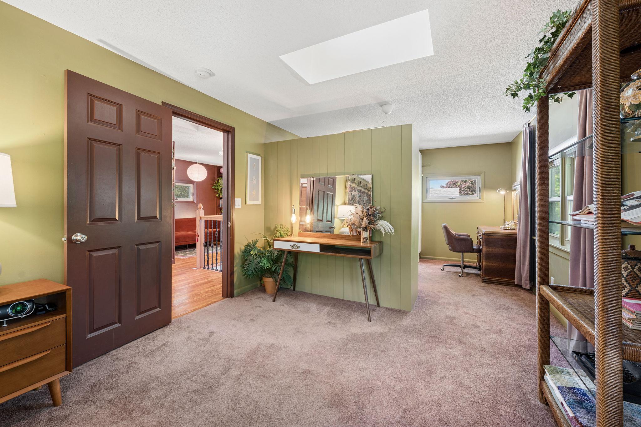 New carpet and a full walk-in closet system (2024) in the oversized primary bedroom.