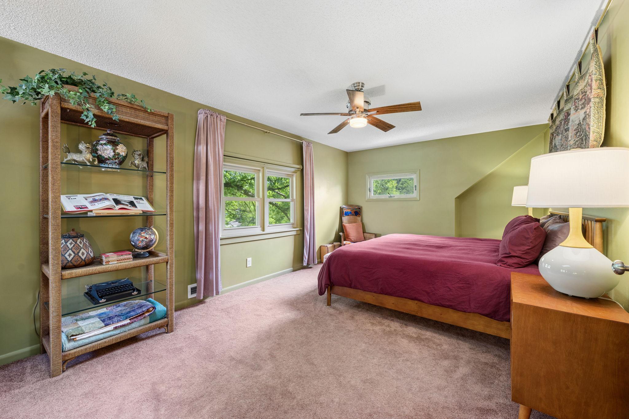 This primary bedroom even comes with a pull-down projector screen for movies nights in bed!