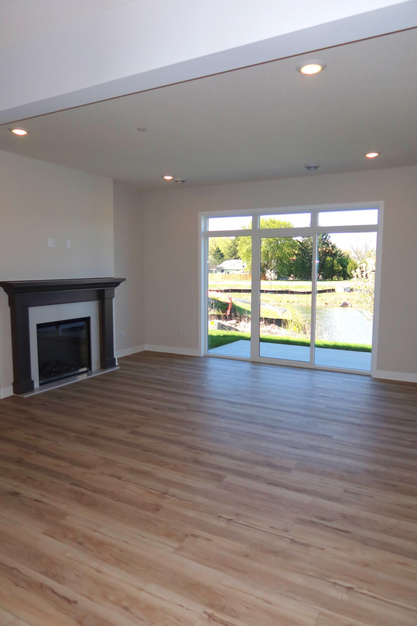 Great Room, Fireplace and Sliding Glass.JPG