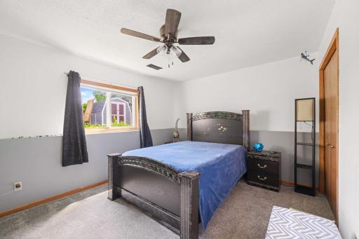 Two lower level bedrooms and a full bathroom are a perfect retreat for guests.