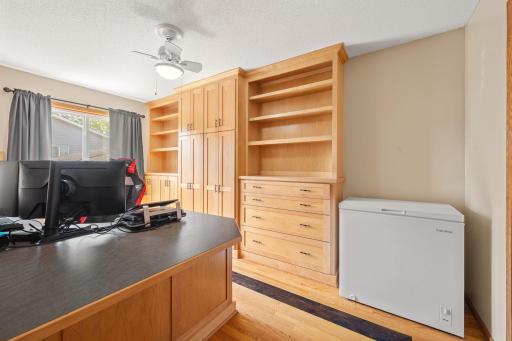 econd main level bedroom, outfitted with thoughtful built-in storage and a built-in desk, makes for an ideal and dedicated home office.