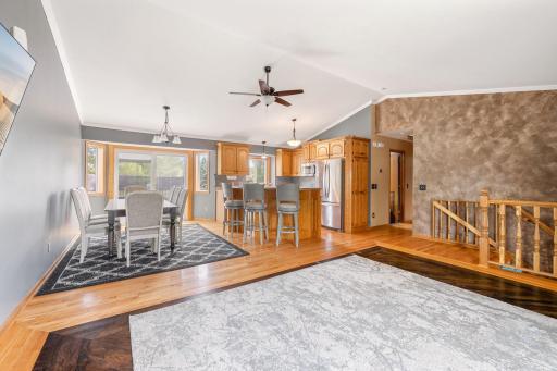 oaring vaulted ceilings and natural light pouring through large windows to create a warm, inviting atmosphere.