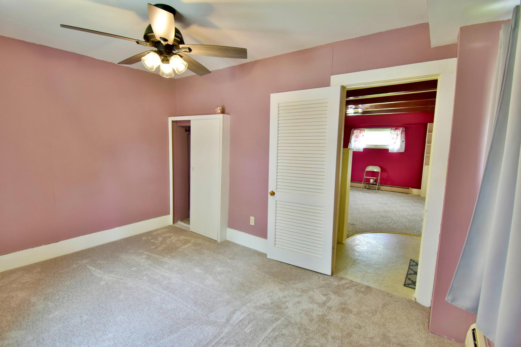 Spacious room, complete with closet and ceiling fan!