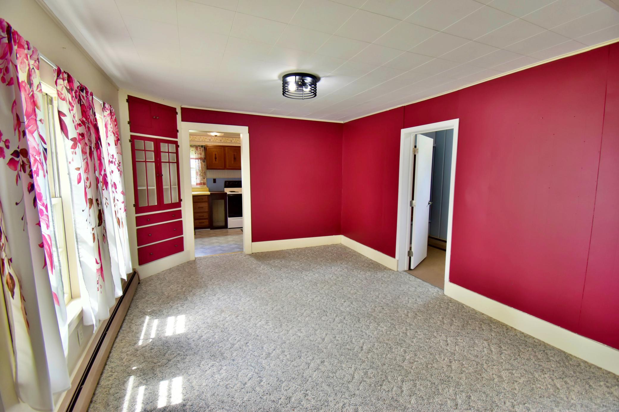 View of the dining area from the living room - note the built ins in the corner!