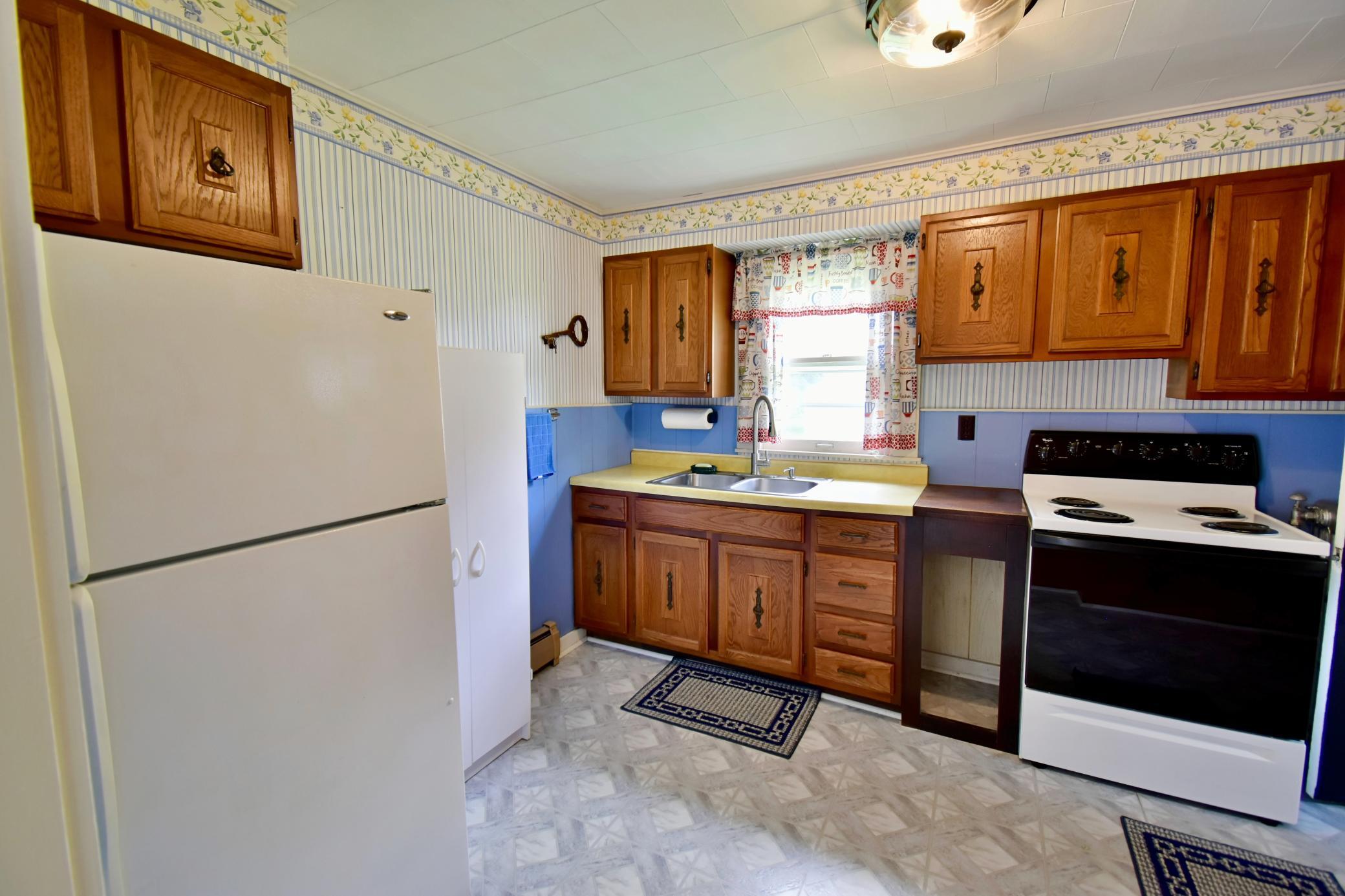 Kitchen area is at the back of the home, convenient to garage and garden location!
