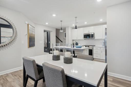 (Photo of a decorated model, actual homes finishes will vary) Ample space for a dining room table!