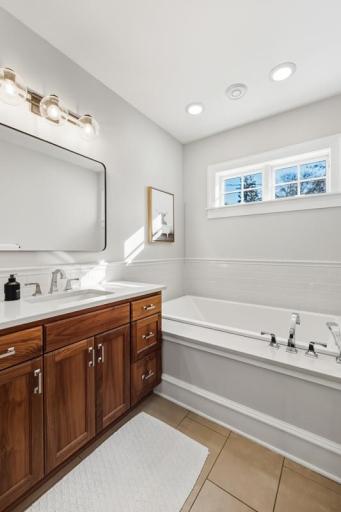 A deep soaking tub offers a quiet place to unwind.