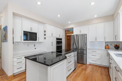 Newer Kitchen with quartz countertops, stainless appliances & more.