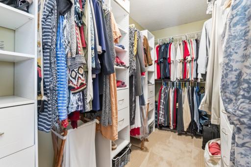 Primary walk-in closet with built-in organizers