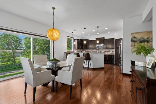 Open concept layout seamlessly connects the dining area and kitchen, creating the perfect space for gatherings and everyday living.