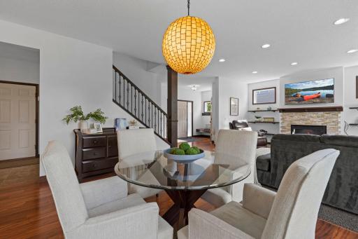 Open concept design ideal for everyday living and entertaining with seamless flow between the dining area, kitchen, and family room.