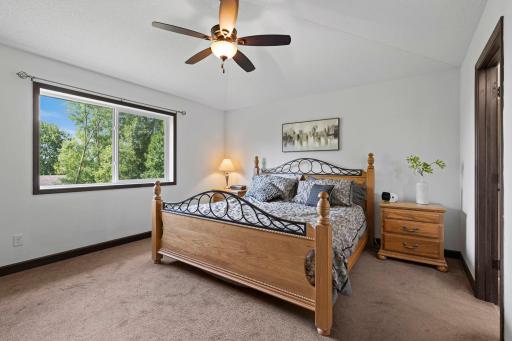 Relaxing primary suite featuring generous space, large windows, walk in closet, and a private ensuite bath.