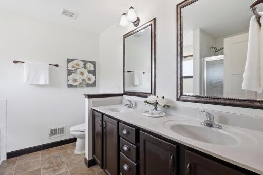 Private primary bath with double sink vanity, abundant counter space, and a functional layout designed for everyday convenience.