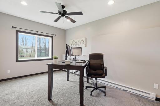 Versatile fourth bedroom offers the flexibility to serve as a guest room, home office, fitness room, or hobby space.