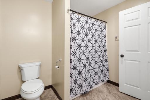 Full lower level bathroom featuring heated floors for year round comfort and convenience.