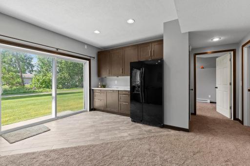 Walkout lower level with large sliding glass door provides easy access to the backyard and fills the space with natural light.