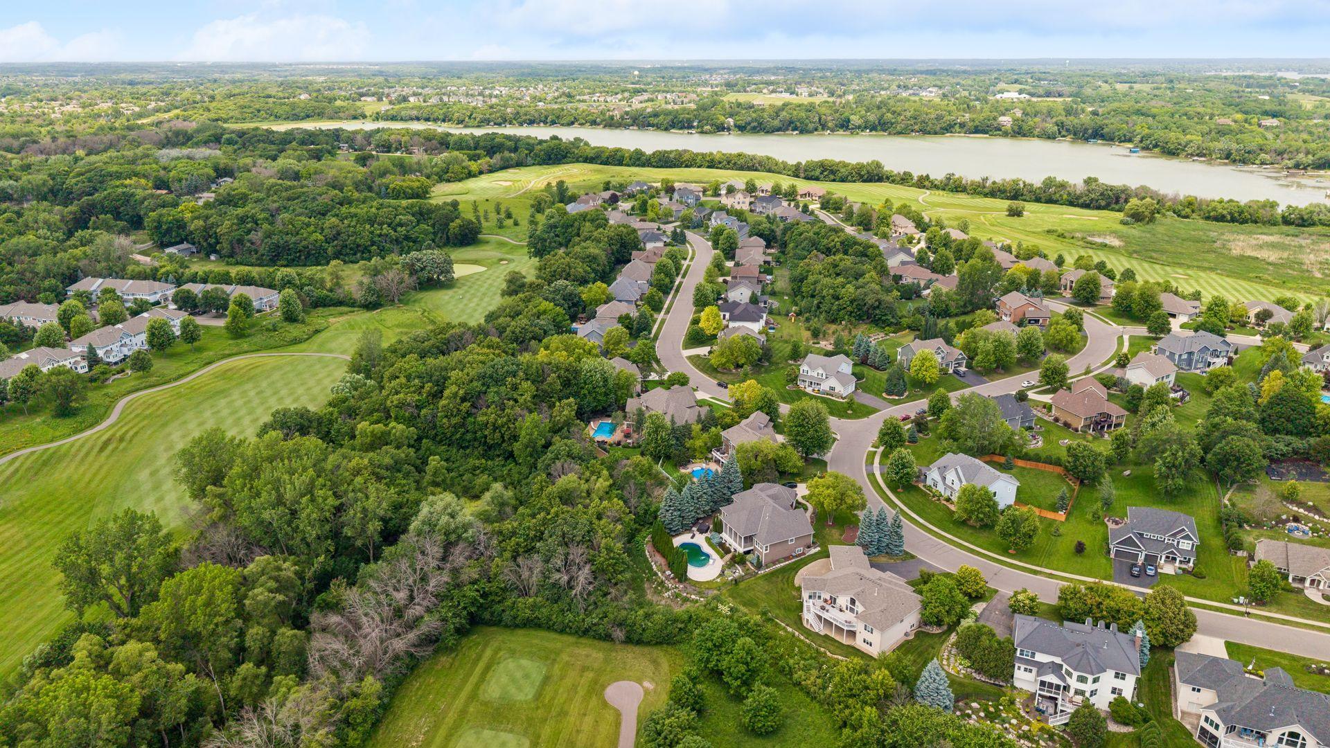 Aerial view of Chaska Town Course and Lake Bavaria in background. Lush, mature neighborhood with big lots and executive level homes. Drive your golf cart to the Club House. Convenience for shopping, entertainment, restaurants and more all nearby.