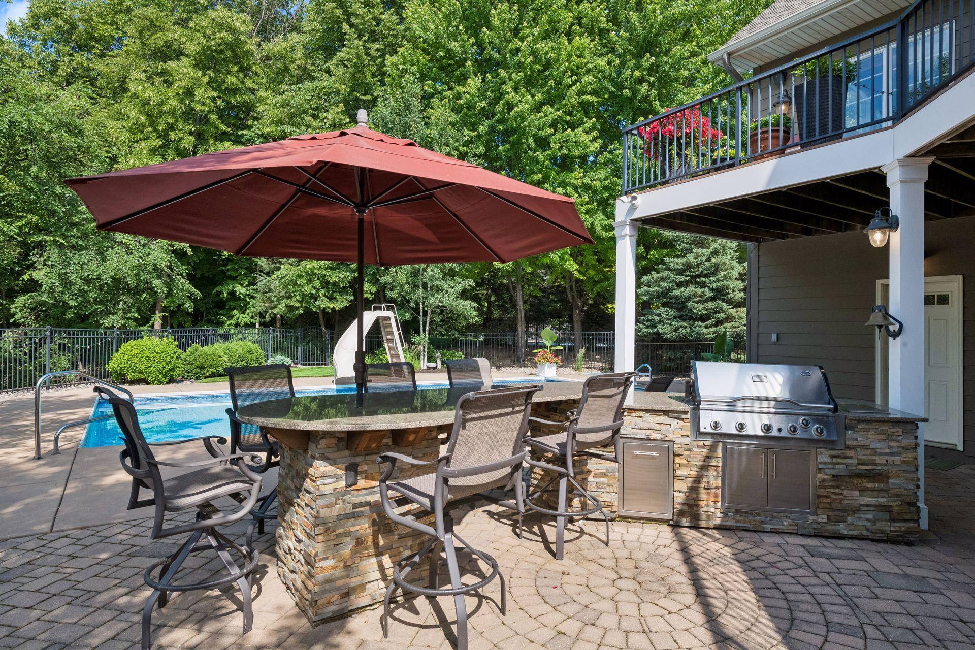 Grilling station with granite tops for ease of entertaining and pool side barbeques.