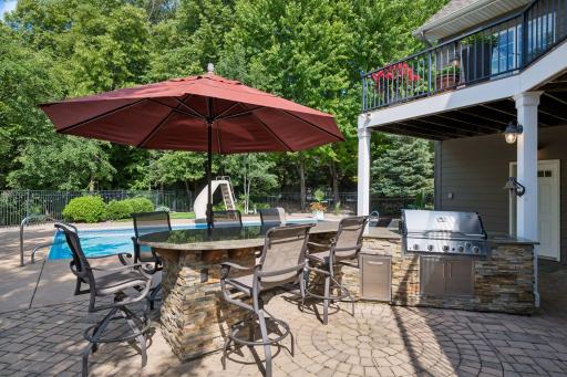 Grilling station with granite tops for ease of entertaining and pool side barbeques.
