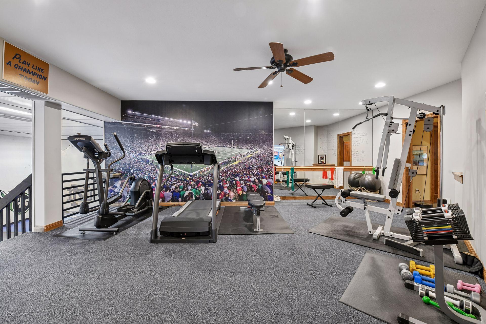 Exercise room with views to the lower-level gym. Mirrors to help your form or if you are a dancer practicing your spins.