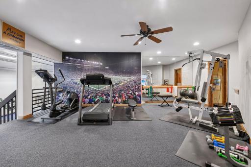 Photo two of Exercise room with views to the lower-level gym. Mirrors on the wall are another bonus to help your form when lifting or if you are a dancer practicing your spins.