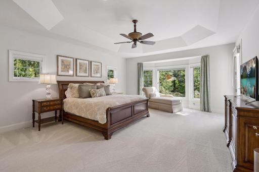 Main level primary suites are hard to find in two story homes, and this one is exceptional! Spacious in size with the best private views to your backyard and access to the upper decking.