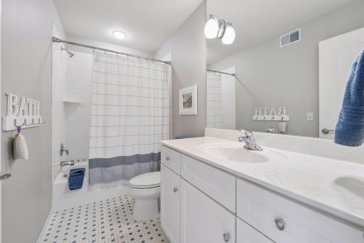 Ensuite tiled full bathroom to accompany bedroom two.