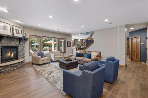 Your lower-level family room awaits you for movie night, game time and more! You will enjoy the stacked stoned 3rd fireplace making this space cozy year-round in this one-of-a-kind home that rarely comes along.