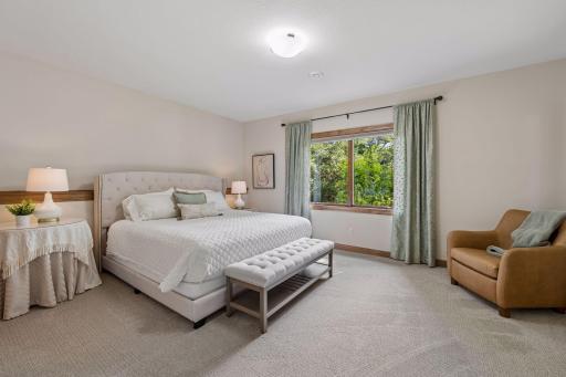 6th lower-level ensuite off the craft room area. and private views out to the backyard.