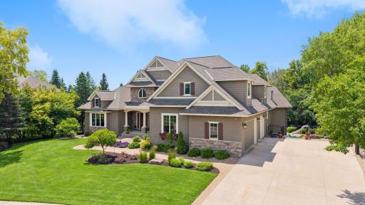Stunning curb appeal with concrete driveway and stamped concrete edging. Home has been professionally landscaped all on sides. Roof 6 years old.