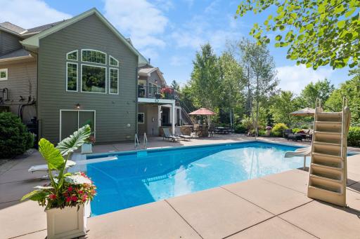 Summer is in full swing and everyone loves to hang at the pool. Now you can everyday as this is your new backyard. NEW pool liner and fun slide plus diving board. Privacy surrounds this backyard which is hard to find.