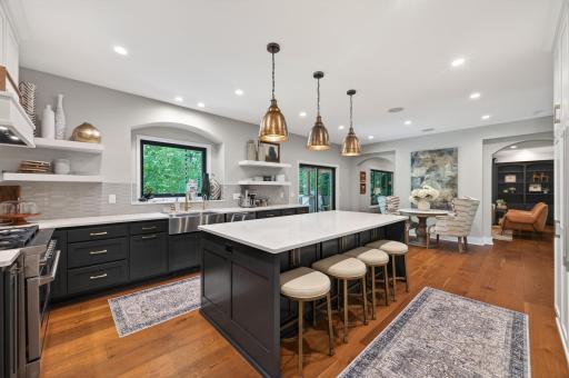 Open-concept layout seamlessly connects the kitchen, dining, and living spaces, creating an ideal environment for entertaining and everyday living.