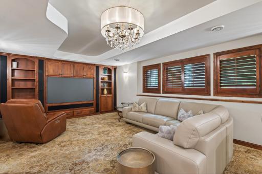 A hidden bookshelf door discreetly conceals utility spaces, adding a distinctive and memorable design element rarely found in todayâs homes.