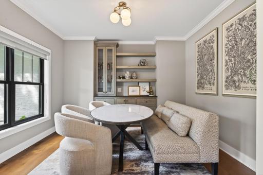Dining area offers custom built-ins, designer lighting, and picturesque views while creating the perfect space for casual dining and entertaining.