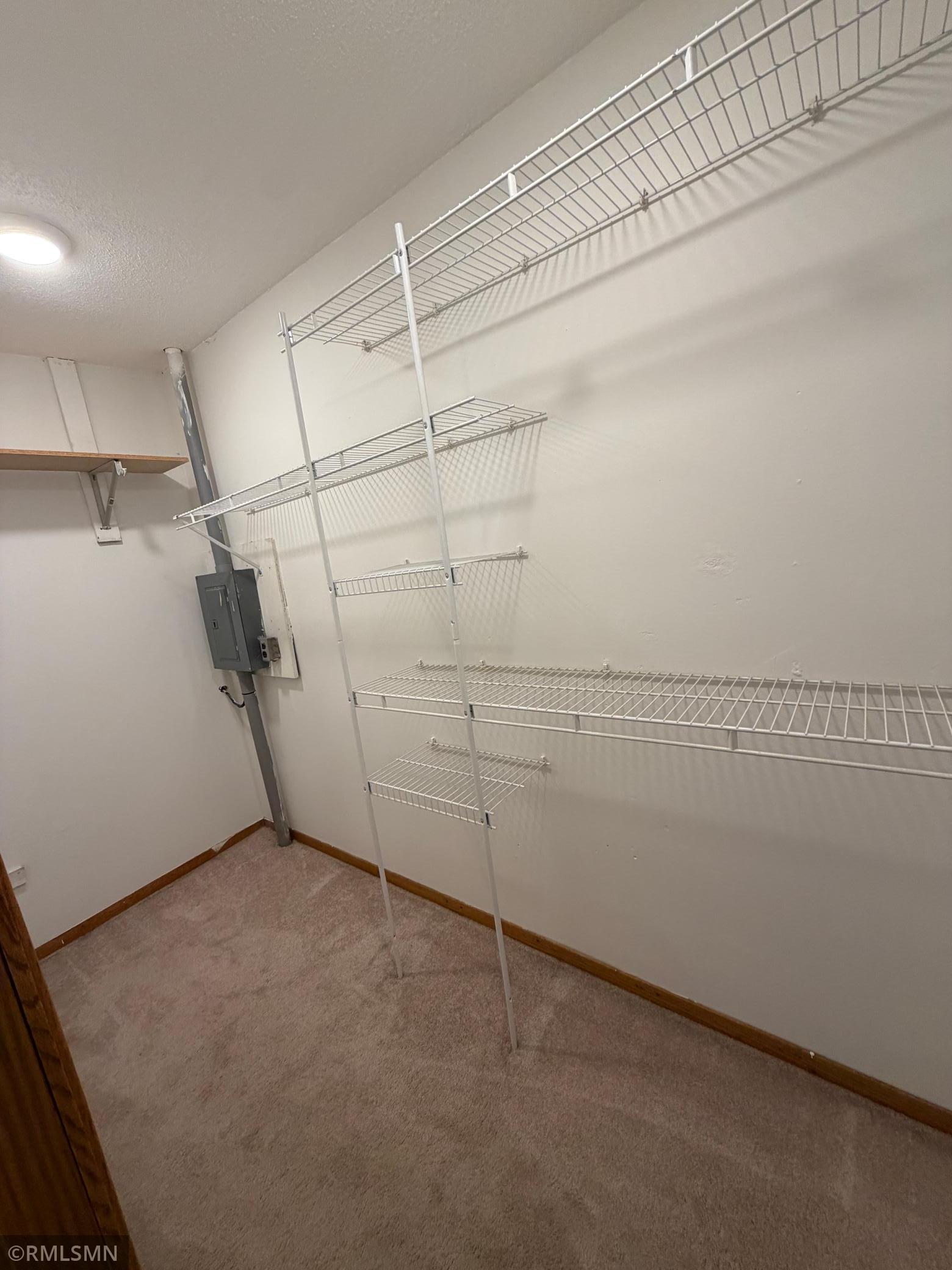 Walk-in closet in 1st bedroom