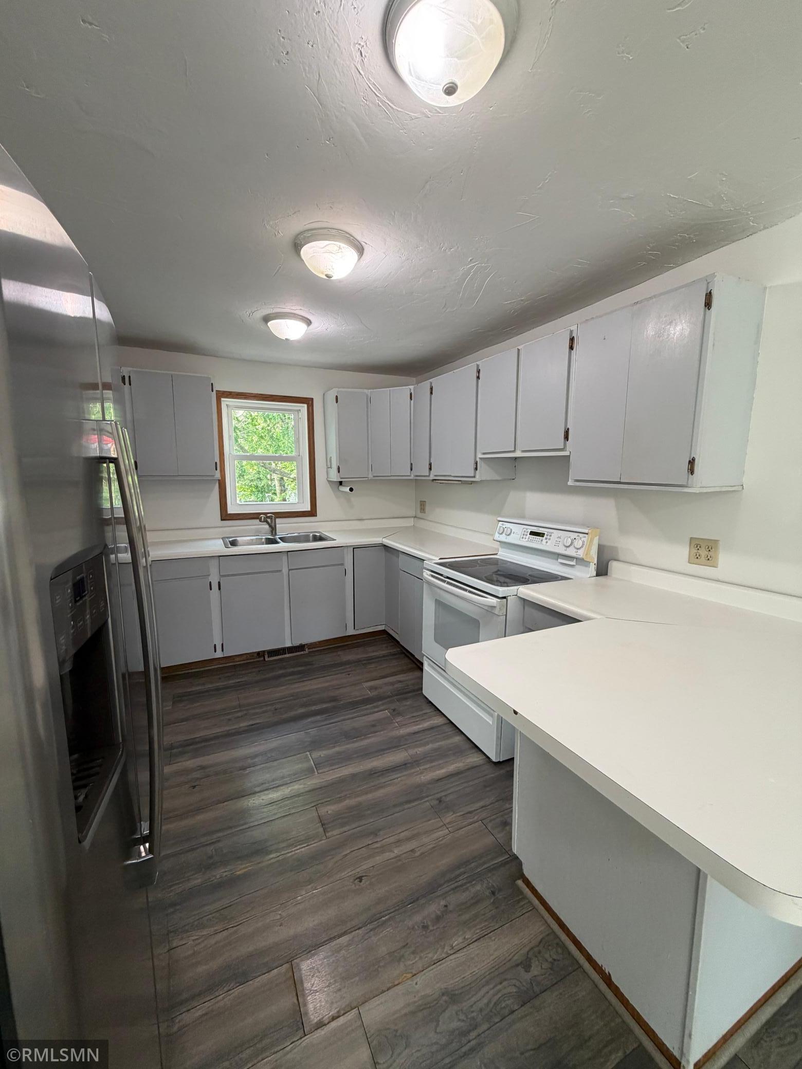 Kitchen with lots of cabinets and counter space.