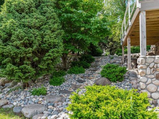 Side of the home with beautiful landscaping