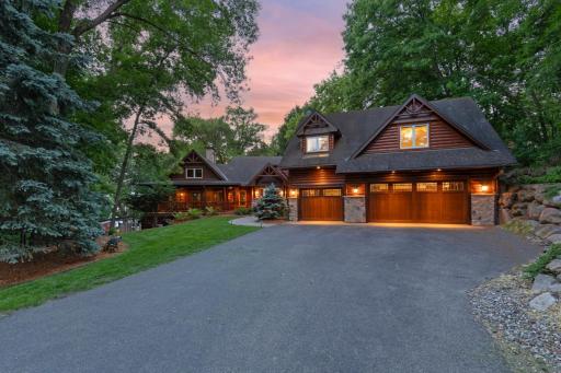Tucked away among towering trees and overlooking the sparkling waters of Lotus Lake, this extraordinary log home estate offers a level of privacy, beauty, and craftsmanship that is rarely available.