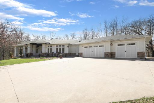 Welcome Home to 9401 Elm Court Prior Lake MN 55372. A striking first impression, timeless design and expansive frontage.
