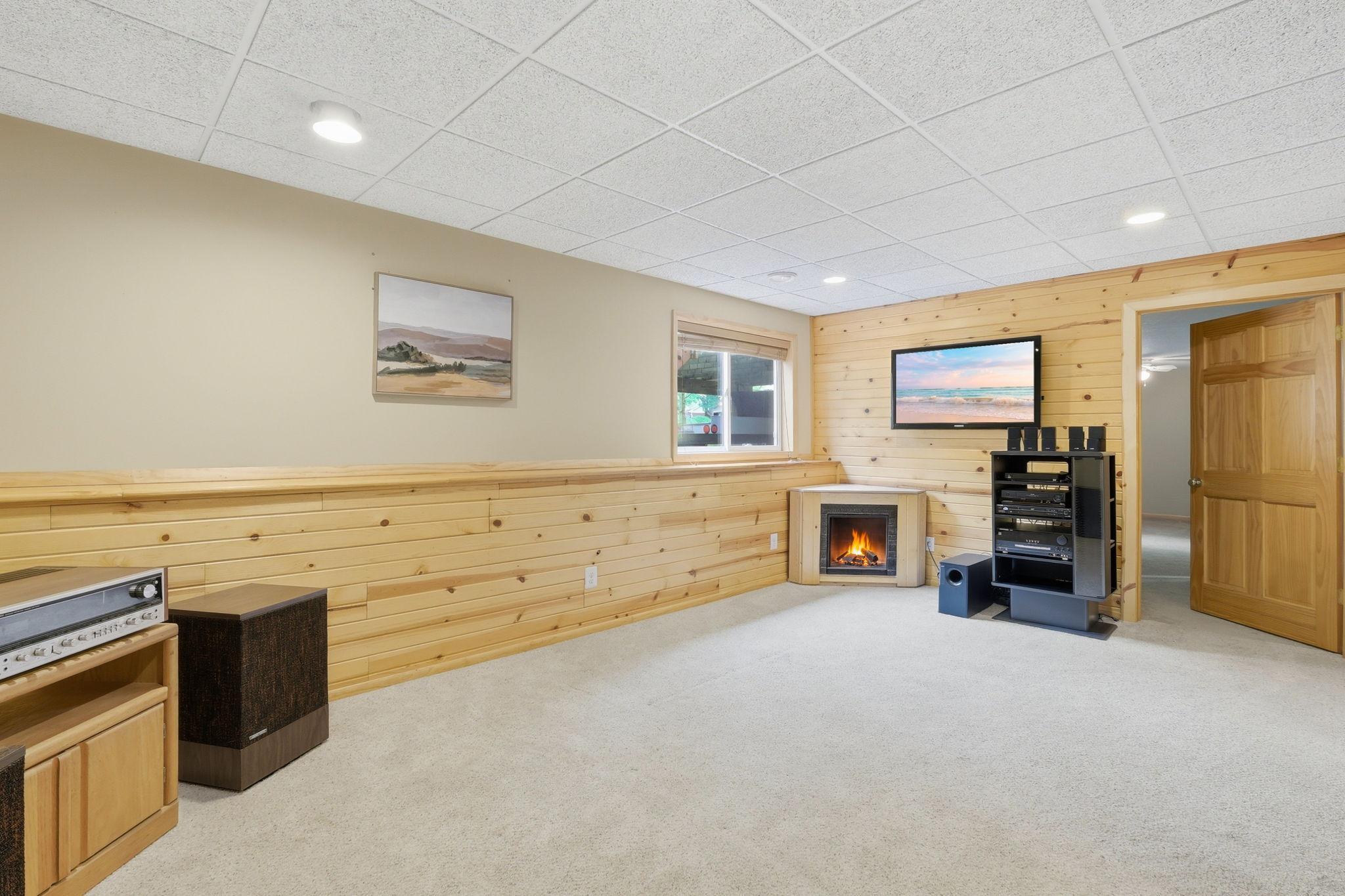 Lower-level family room with electric fireplace