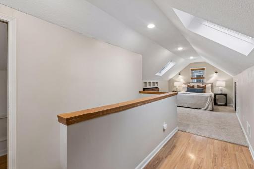 A skylight above fills the space with natural light, creating a bright transition that enhances the home's timeless appeal.