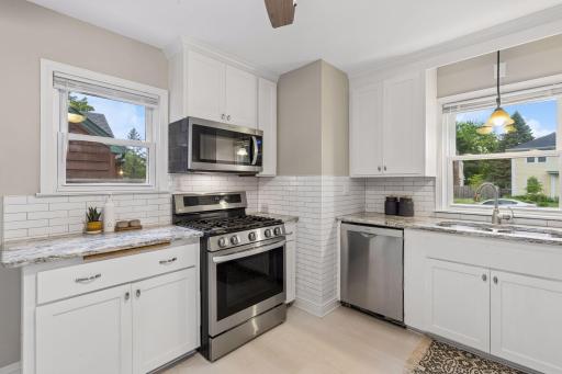 The beautifully updated kitchen is truly the heart of the home.