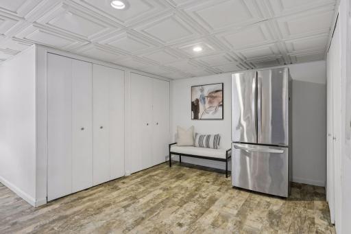 Just beyond the family room is an impressive storage area with multiple built-in closets, keeping seasonal dÃ©cor, hobbies, and everyday essentials neatly organized while maximizing usable living space.