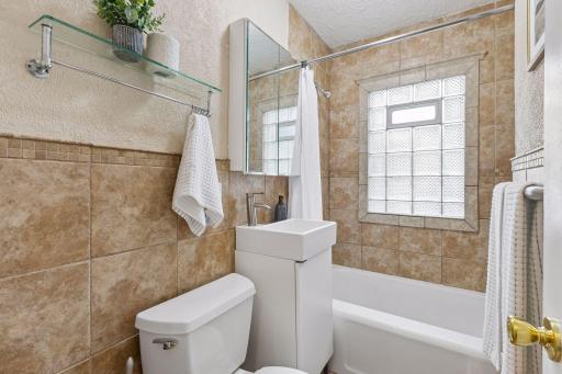 The updated main floor bathroom combines timeless style with everyday functionality.