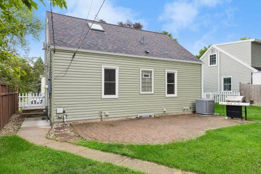 Step outside to a spacious backyard with room to play, garden, or entertain. The brick patio provides the perfect setting for grilling, outdoor dining, or simply enjoying Minnesota's beautiful seasons.